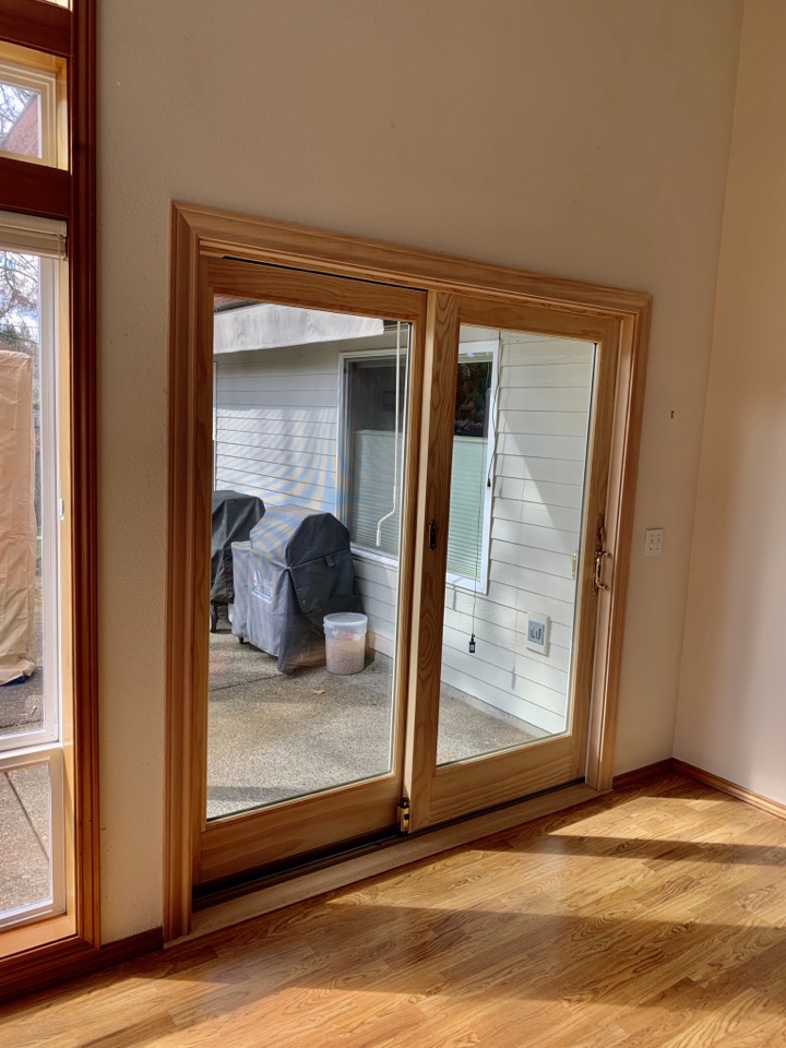 Hillsboro, OR - Pine wood finish sliding patio door glider. Hemlock stain grade interior finish carpentry Hillsboro, OR - Pine wood finish sliding patio door glider. Hemlock stain grade interior finish carpentry