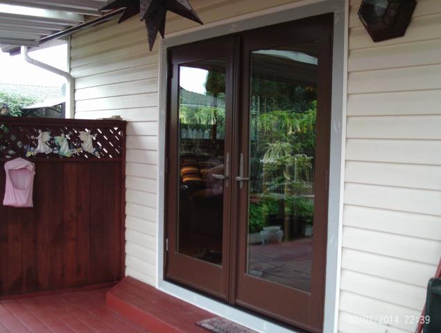 Longview, WA - A series out swing door. Cocoa bean/ oak. Longview, WA - A series out swing door. Cocoa bean/ oak.