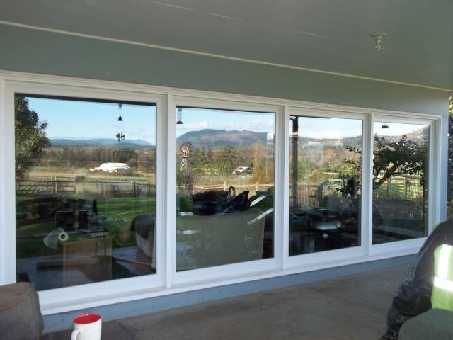 Pleasant Hill, OR - Replacing 14 single pane metal windows. Installing 14 white windows, including seven large tempered picture windows in the living room. Pleasant Hill, OR - Replacing 14 single pane metal windows. Installing 14 white windows, including seven large tempered picture windows in the living room.