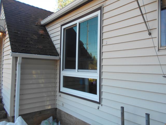 Oregon City, OR - We replaced the two front picture windows with a 1 glider over a tempered pw white and pine with stone hardware we are also doing a six panel smooth star non finished Oregon City, OR - We replaced the two front picture windows with a 1 glider over a tempered pw white and pine with stone hardware we are also doing a six panel smooth star non finished