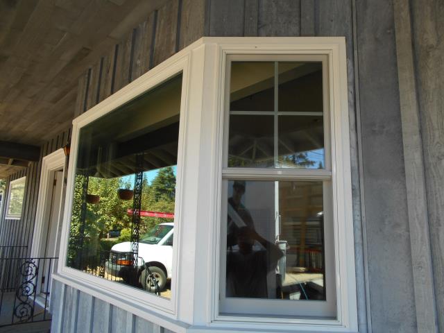 Milwaukie, OR - Installing five windows and two 2 panel doors with four sidelights. Three white windows with white hardware in living room will replace five casements currently arranged in a bay window; Double hungs on each end and one picture replacing three casements in the middle. Milwaukie, OR - Installing five windows and two 2 panel doors with four sidelights. Three white windows with white hardware in living room will replace five casements currently arranged in a bay window; Double hungs on each end and one picture replacing three casements in the middle.