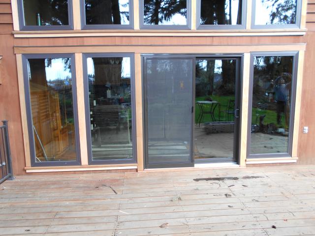 Lebanon, OR - We installed 22 replacement windows in this gorgeous home including this gorgeous sun room where they layered picture windows to welcome in the warm sun. We also installed 2 sliding glass doors for this beautiful place in Lebanon! Lebanon, OR - We installed 22 replacement windows in this gorgeous home including this gorgeous sun room where they layered picture windows to welcome in the warm sun. We also installed 2 sliding glass doors for this beautiful place in Lebanon!