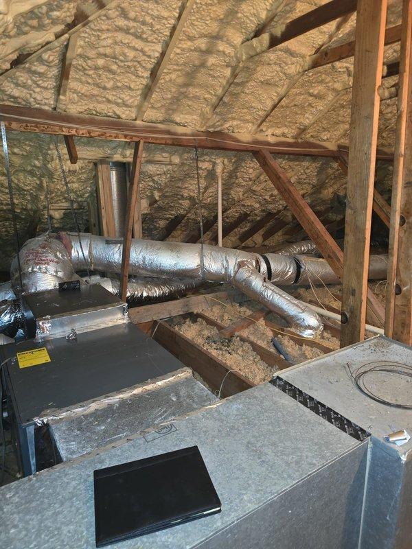 Completed full system installation of a side discharge HVAC unit in customer's home. Rewired secondary transformer according to specifications, replaced 9-inch ductwork, corrected exhaust piping elbow, and sealed plenum to ensure optimal system performance. Verified proper installation of all components in attic/crawl space, including insulated ductwork connections and furnace placement.