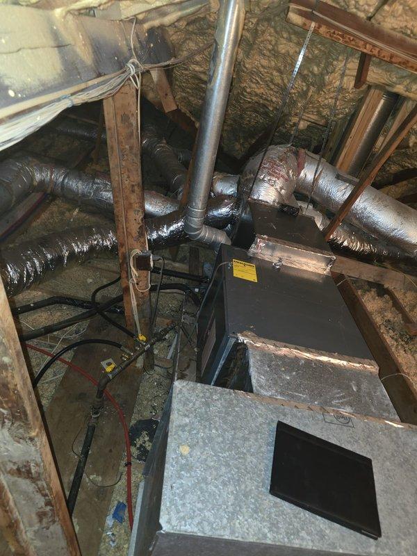 Completed full system installation of a side discharge HVAC unit in customer's home. Rewired secondary transformer according to specifications, replaced 9-inch ductwork, corrected exhaust piping elbow, and sealed plenum to ensure optimal system performance. Verified proper installation of all components in attic/crawl space, including insulated ductwork connections and furnace placement.