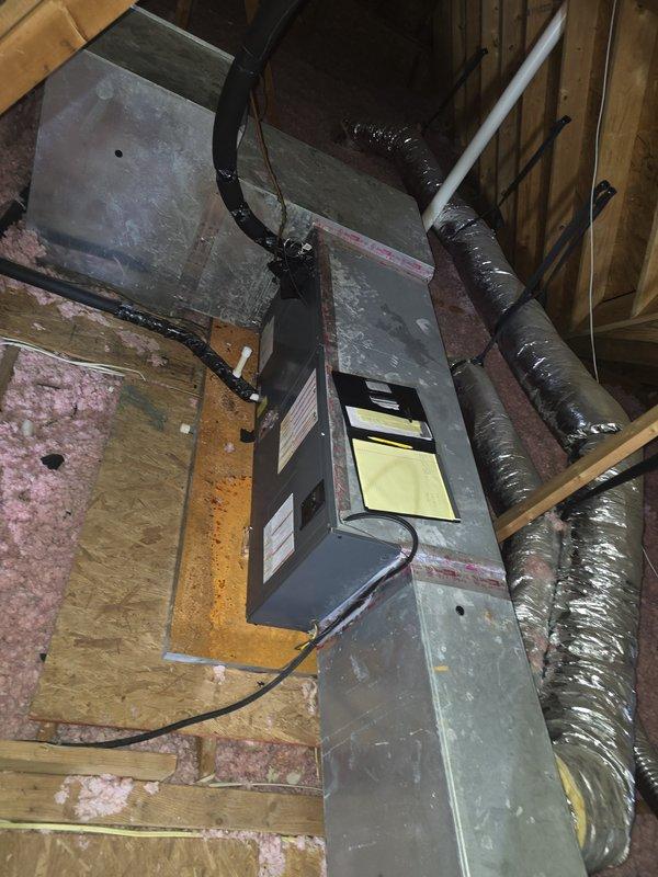 Completed installation of a new 2.5 ton Goodman HVAC system, including outdoor condensing unit mounted on concrete pad with proper electrical disconnect and horizontal air handler secured in attic with insulated ductwork. System is operational with 10-year parts and 2-year labor warranty.