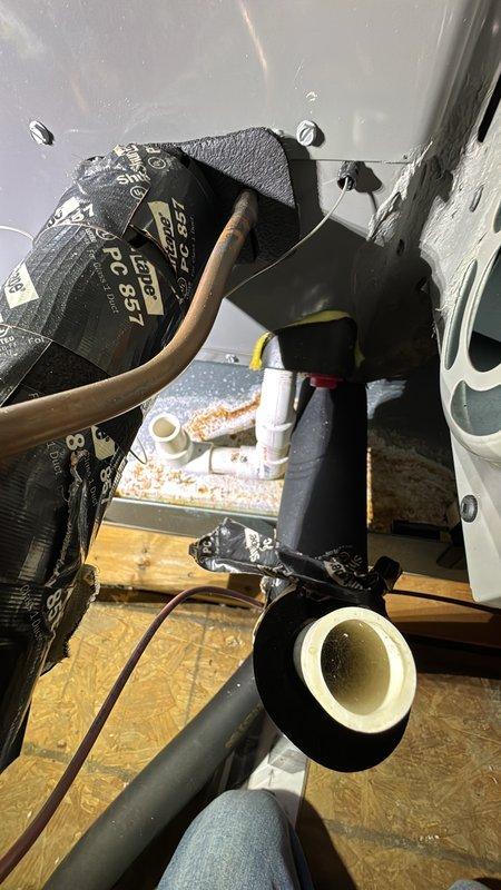 Performed diagnostic on AC system with reported compressor issue. Inspected electrical control system components including contactor/relay and associated wiring connections. Examined system interior including copper refrigerant lines, insulation, and drainage components to determine source of cooling failure.