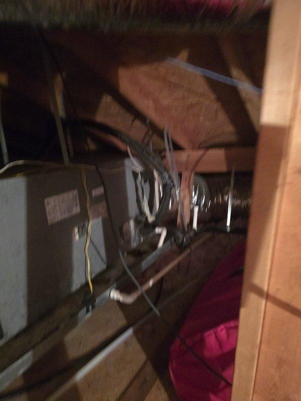 Successfully installed a new deluxe 2.5 ton electric side discharge system with proper electrical connections to the exterior meter and breaker box. Unit was mounted on concrete pad with appropriate clearances, and interior components were installed in the utility space with all necessary ductwork and wiring completed. Documented installation with photos of both exterior condenser unit and interior air handler/furnace setup.