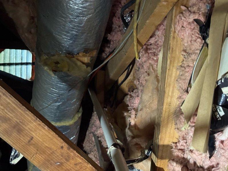 Removed and replaced primary drain pan to correct improper drainage issue. Secured mounting bracket and verified proper installation within the attic space. Replacement pan was sourced from alternate location for timely completion of service.