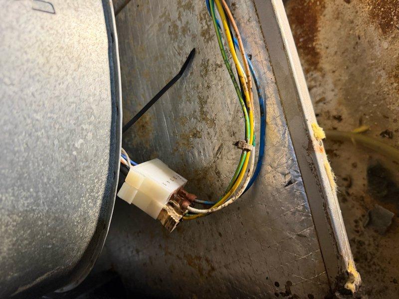 Diagnosed HVAC system after customer reported smoke and complete system failure. Inspection revealed significant corrosion at heat exchanger junction and compromised electrical connections with visible heat damage. Confirmed unit is still under manufacturer warranty as it was installed less than two years ago.