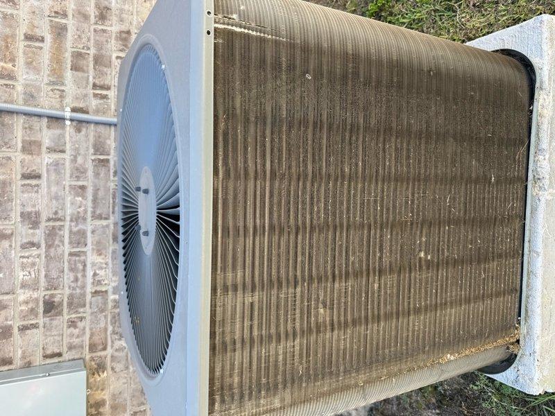 Performed routine maintenance on a 1-year-old HVAC system with systematic access located in the garage. Thoroughly cleaned the outdoor condenser unit, removing significant dust and debris buildup from the metal cooling fins and coil assembly that was affecting system efficiency. Unit is now clean and operating at optimal performance levels for the home sale inspection.