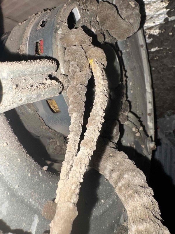 Responded to no cooling complaint on third floor hallway unit. Found evaporator coil completely frozen with heavy ice buildup. Upon inspection, discovered extensive dust and lint accumulation on coil surfaces and throughout air handler cabinet, restricting airflow and causing freeze condition. Unit was already shut off upon arrival. Documented equipment condition including unit model 2TE95F18B10DDA4 manufactured 7/10/2019. System requires thorough coil cleaning, filter replacement or upgrade, and airflow restoration to resolve freezing issue and restore cooling operation.