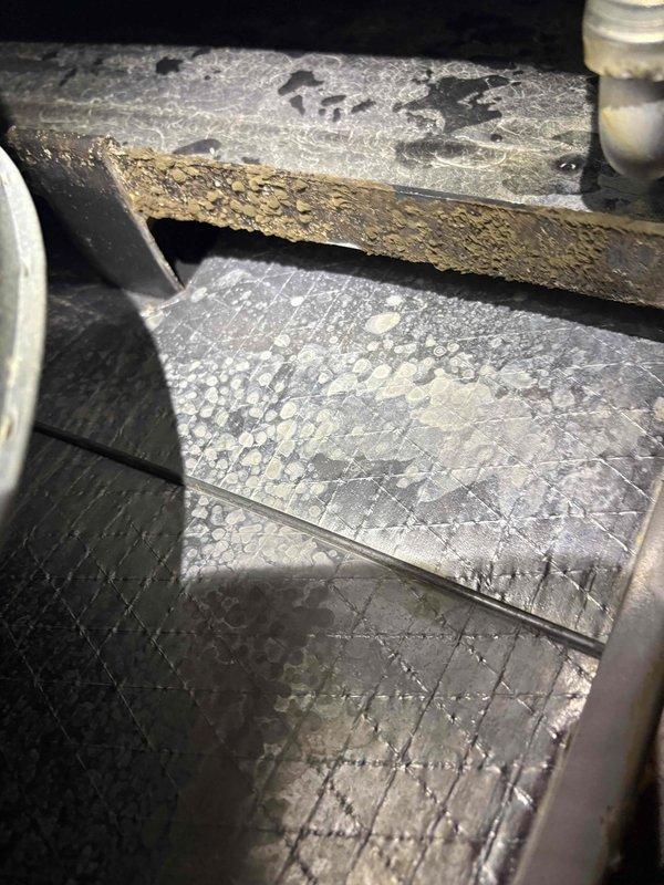 Completed spring maintenance on single HVAC system. Inspection revealed condensation accumulation on ductwork insulation and significant corrosion on metal support bracket within air handling unit, indicating potential moisture intrusion issues. Also observed foam insulation sealing around equipment penetrations and component openings. System evaluated for seasonal operation and proper function.