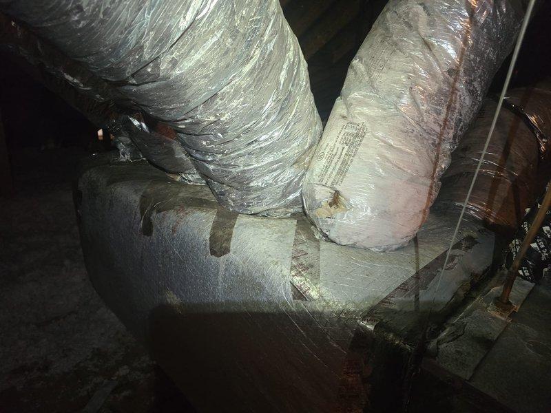 Conducted estimate revisit to verify HVAC system sizing and ductwork compatibility in attic space. Documented existing flexible ductwork installation, including insulated supply ducts, plenum connections, and current insulation conditions. Photographed system configuration to confirm specifications for equipment replacement recommendations.