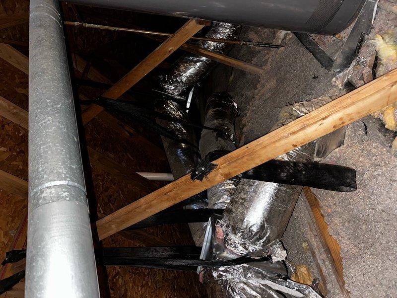 Installed twelve 8-inch stovepipe dampers on non-insulated wye fittings in attic HVAC system. Removed existing flexible ductwork connections, installed dampers at each wye location, reconnected flex ducting, and reinsulated all connections to restore proper system integrity and provide individual zone control.