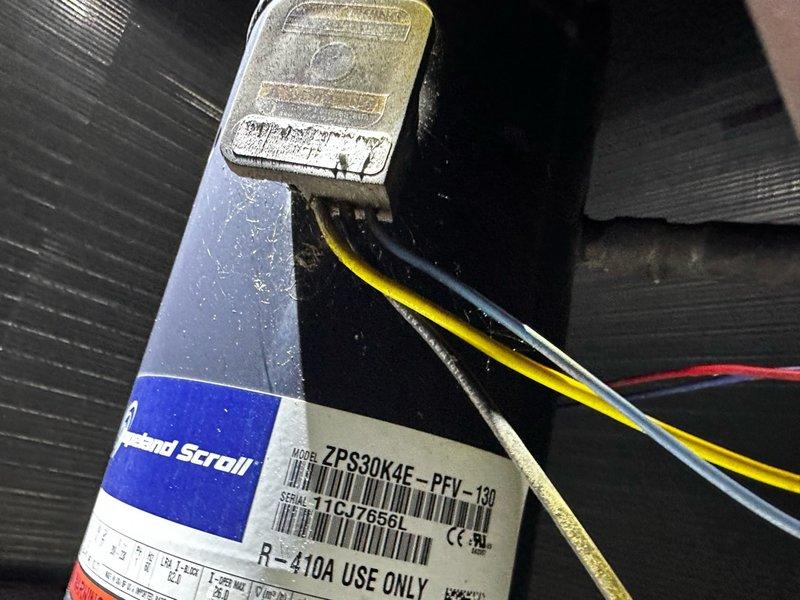 Responded to callback for back bedroom unit experiencing humming noise and cycling on/off following previous day's service. Upon arrival, performed diagnostic testing on system components. Tested dual-run capacitor (TOTALINE P291-4054RS, 40+5 MFD 370-440VAC) using digital multimeter, which revealed failed capacitor reading of 142.6 microfarads, significantly below manufacturer specifications. Inspected Copeland Scroll compressor (Model ZPS30KAE-PFV-130, R-410A) and associated electrical connections. Replaced defective capacitor to restore proper compressor operation and eliminate humming noise and short-cycling condition. Verified all electrical connections secure and system operating within normal parameters. Unit tested and confirmed operating properly with no abnormal sounds or cycling issues.