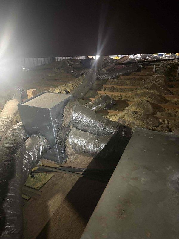 Responded to no cooling complaint at residential property. Upon arrival, accessed HVAC system located in attic space via rear building entrance as directed. Performed diagnostic evaluation of air handler and ductwork system. Inspected HVAC unit, flexible duct runs, and overall system operation in unconditioned attic space. Documented existing conditions including ductwork configuration, insulation installation, and equipment placement. Completed visual assessment of mechanical components and identified potential issues affecting cooling performance.