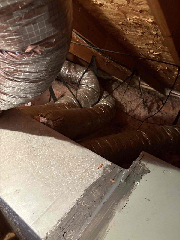 Completed spring maintenance inspection on HVAC system with focus on ductwork and mechanical components in attic space. Examined flexible duct runs, insulation integrity, and overall system accessibility. Documented existing conditions including aged ductwork with surface debris accumulation and verified proper duct support and fastening throughout accessible areas.