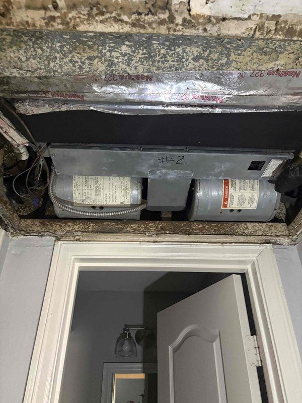 Responded to AC issue with moisture buildup at ceiling access panel and condensation on exterior unit refrigerant line. Performed diagnostic inspection of indoor air handler components, electrical connections, and blower assembly. Documented existing water damage and HVAC system condition for further evaluation of potential drain line obstruction or refrigerant flow issues.