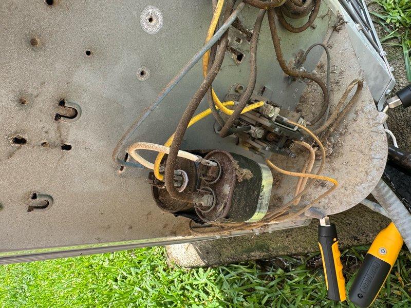 Responded to no cooling call where customer reported unit not starting despite hearing clicking from thermostat. Upon arrival, performed diagnostic inspection of outdoor unit and found heavily corroded compressor and motor components with extensive rust damage on concrete pad. Inspected indoor air handler and ductwork system in attic space. Diagnosed system failure due to severe corrosion of outdoor unit components preventing proper operation. Advised customer of findings and recommended replacement of outdoor condensing unit due to extent of deterioration affecting electrical and mechanical components.