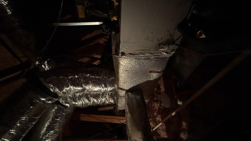 Responded to no cooling call where customer reported unit not starting despite hearing clicking from thermostat. Upon arrival, performed diagnostic inspection of outdoor unit and found heavily corroded compressor and motor components with extensive rust damage on concrete pad. Inspected indoor air handler and ductwork system in attic space. Diagnosed system failure due to severe corrosion of outdoor unit components preventing proper operation. Advised customer of findings and recommended replacement of outdoor condensing unit due to extent of deterioration affecting electrical and mechanical components.