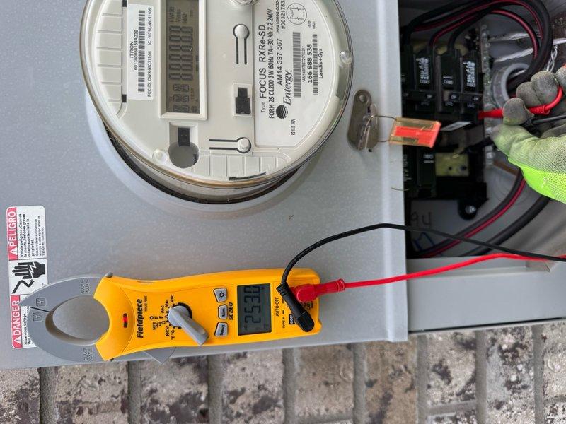 Responded to no cooling complaint on residential AC unit. Upon arrival, confirmed system was running but not producing cool air with thermostat functioning properly. Performed electrical diagnostics using digital multimeter at both the main electrical panel and outdoor condensing unit. Testing revealed failed capacitor at outdoor unit, evidenced by out-of-range readings and visible corrosion on terminal connections. Capacitor replacement required to restore proper compressor operation and cooling capacity.