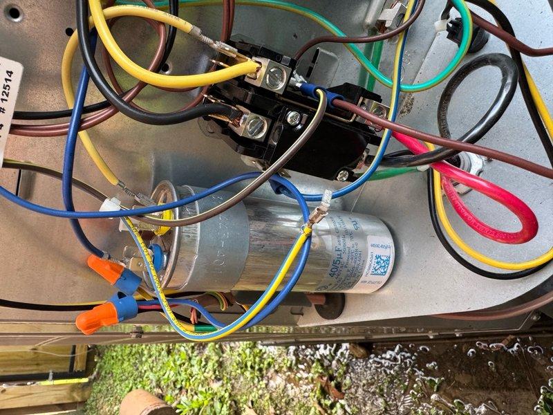 Responded to no cooling complaint with unit running but interior temperature at 80 degrees. Upon inspection, found failed capacitor preventing compressor from operating properly. Replaced defective capacitor, verified all electrical connections, tested unit operation, and confirmed system cooling effectively with proper amp draw and temperature differential.