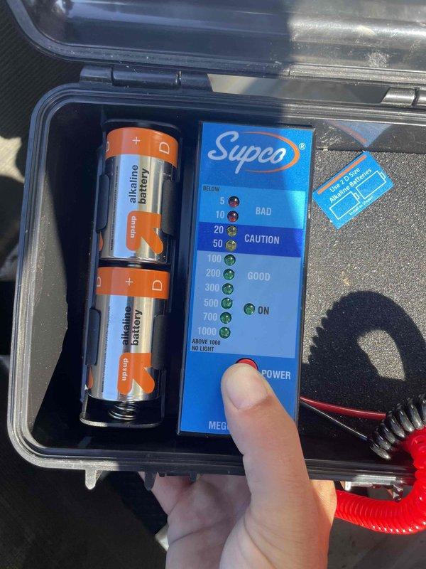 Completed spring maintenance on residential air conditioning system. Inspected outdoor condenser unit including fan assembly and protective guard, performed standard seasonal preventive maintenance procedures, and tested system capacitor using digital meter to verify proper electrical function and ensure optimal system performance for the cooling season.