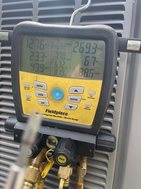 Responded to service call for clogged drain pan and blower speed adjustment request. Performed diagnostic inspection of HVAC system, verifying drain pan had been previously cleared but conducting thorough assessment to ensure proper drainage and no remaining blockages. Evaluated system operation and refrigerant pressures using manifold gauges, confirming readings within normal parameters. Inspected blower motor and fan assembly for proper operation. Adjusted blower motor speed to lower setting per customer request to reduce airflow velocity. Tested system operation following adjustments to verify proper functionality and adequate cooling performance at reduced fan speed. Documented system conditions with diagnostic equipment readings and component photography for service records.
