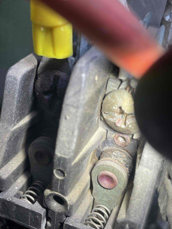 Completed spring maintenance inspection on residential HVAC system. Accessed attic-mounted air handler unit and inspected ductwork, connections, and overall system condition. Identified significant corrosion and deterioration on mechanical components requiring attention. Documented system condition with photographs showing flex ductwork routing, insulated supply lines, and corroded metal housing with visible surface cracks and oxidation around mounting points.