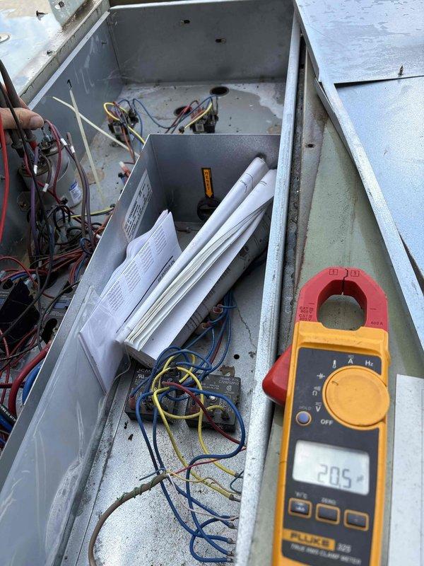 Replaced two 25 MFD capacitors for the condenser fan motors on the right front unit. Obtained the required capacitors and returned to complete the installation, restoring proper operation to the system.