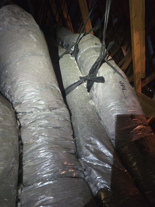 Completed installation of flexible ductwork system in attic space, including proper routing of insulated ducts through roof framing and securing with appropriate straps and fasteners. All ductwork was installed per specifications with reflective insulation material and is ready for system connection once the plenum is retrieved from the supplier.