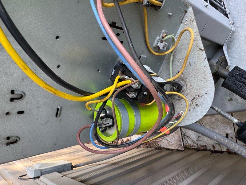 Responded to no cooling call where outdoor unit failed to operate despite thermostat functioning properly. Upon inspection, discovered failed run capacitor preventing compressor and condenser fan motor from starting. Removed defective capacitor and installed new replacement unit with proper microfarad rating. Verified all electrical connections secure, tested system operation, and confirmed outdoor unit now running normally with proper amp draw on both compressor and fan motor.