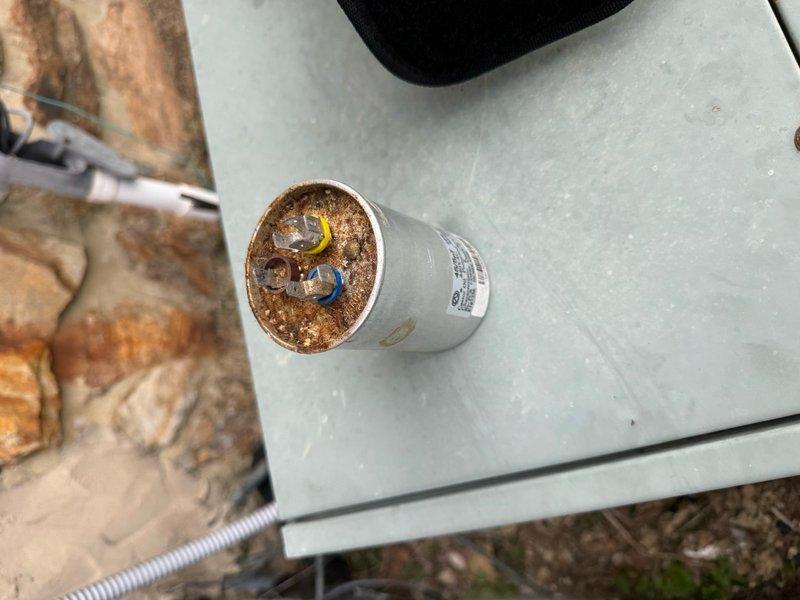 Completed spring maintenance on two HVAC systems. Upstairs unit was blowing hot air due to a severely corroded dual-run capacitor, which was identified and replaced to restore proper cooling operation. Changed 16x20x1 air filter and performed standard maintenance procedures on both systems.