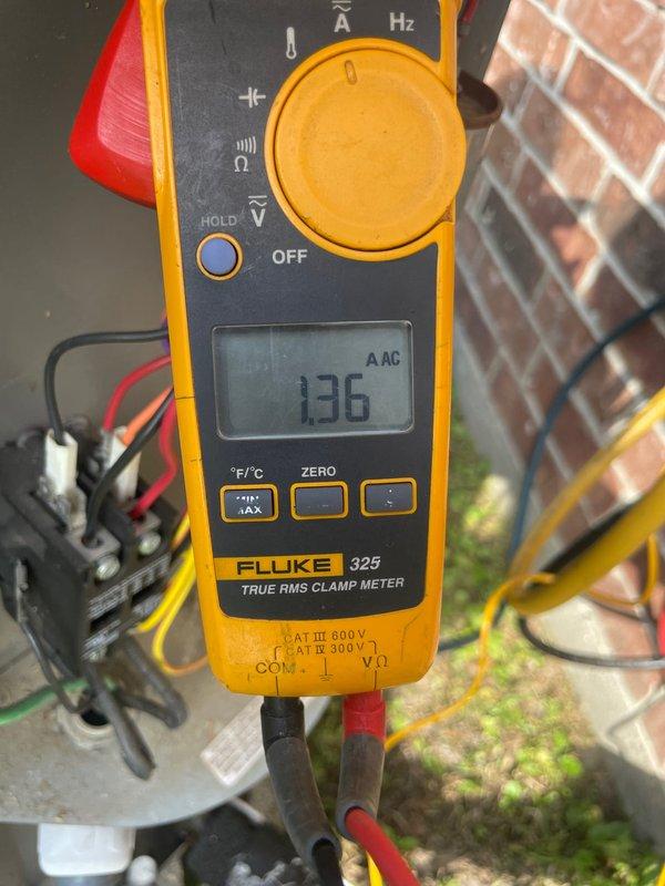 Completed spring maintenance on a 9-year-old gas HVAC unit, including electrical diagnostics with amperage readings at 136A AC and capacitor inspection. Replaced air filter with customer-supplied unit and documented damaged ductwork insulation showing deterioration and separation of outer metallic layer in the crawl space area.