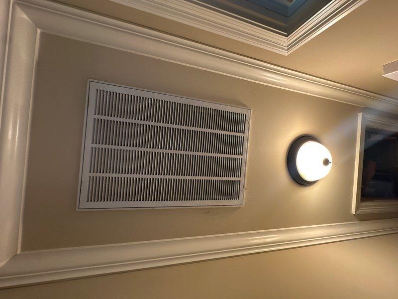 Completed comprehensive preventative maintenance service on residential HVAC system including heating and cooling components. Performed standard system inspection, cleaned air conditioning coils, checked refrigerant levels, tested electrical connections, and verified proper airflow throughout the system. During inspection, documented significant frost buildup on attic-mounted air handler unit indicating potential airflow restriction or refrigerant issue requiring further evaluation. Verified interior return air vents and registers for proper operation and discussed findings with property owner regarding additional repairs needed beyond routine maintenance scope.