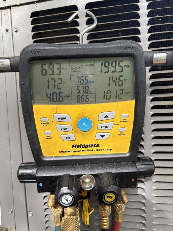 Responded to no cooling call with outdoor unit freezing up and no airflow from blower. Performed diagnostic evaluation using refrigerant manifold and micron gauge to assess system pressures and temperatures. Inspected electrical disconnect box and documented system conditions for further repair recommendations.