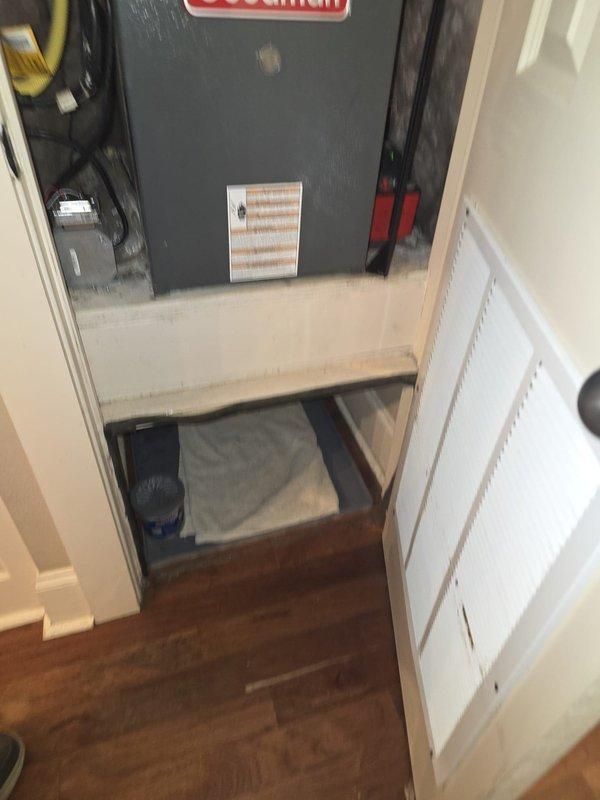 Completed full system installation of Amana 2.5 ton gas heating and cooling system per purchase order J0474-001. New equipment installed in mechanical closet with proper clearances, including air handler and condensing unit, with all electrical connections, refrigerant lines, and ductwork transitions completed to manufacturer specifications. System tested and operational with return air grille properly positioned for adequate airflow.