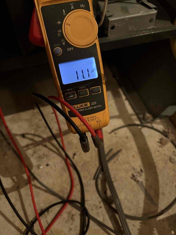 Responded to no cooling complaint with outside unit running. Upon inspection, measured compressor amperage at 111 amps using clamp meter, indicating severely elevated current draw well above normal operating parameters. Diagnosed failed compressor drawing excessive amperage, preventing proper refrigerant compression and resulting in no cooling output despite unit operation. Advised customer of findings and provided replacement options.