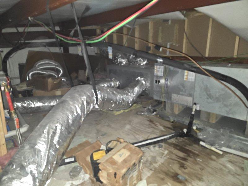 Completed estimate for installation of three ductless mini-split systems in commercial conference rooms. Assessed requirements for 1-ton, 1.5-ton, and 2-ton capacity units based on room specifications. Photographed existing HVAC infrastructure including attic-mounted air handler with flexible ductwork and basement ductwork routing to determine optimal placement for new mini-split indoor and outdoor units.