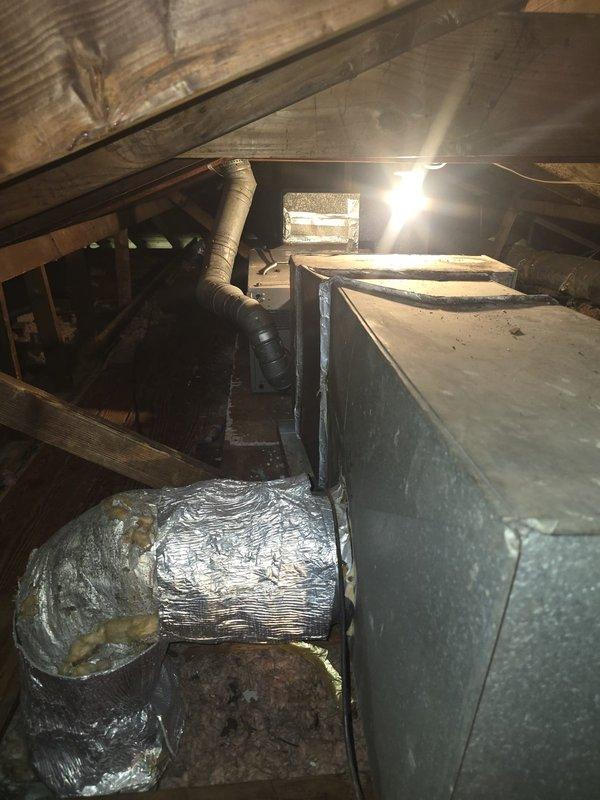 Responded to customer request for complete HVAC system replacement estimate following fire damage to existing equipment. Accessed attic space to assess damaged ductwork and air handler unit, documenting extensive heat damage to main supply plenum and flexible duct connections. Observed compromised insulation on flexible ductwork and deteriorated metal components throughout the system. Took detailed measurements and photographs of existing installation layout, including duct routing, clearances, and structural framing conditions. Evaluated attic access points and working space requirements for new equipment installation. Prepared comprehensive quote for new HVAC system installation including removal and disposal of fire-damaged components.