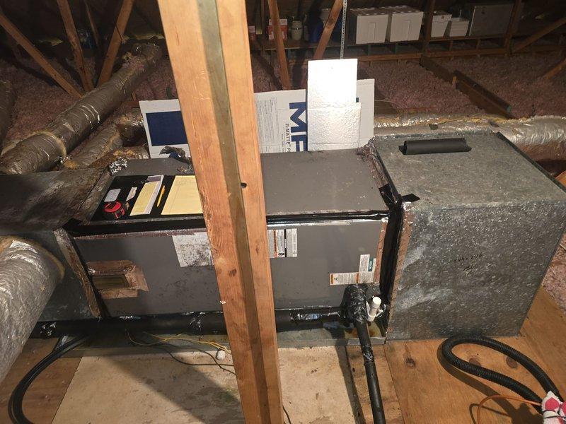 Conducted comprehensive assessment of 13-year-old Rheem HVAC system to provide replacement estimate options for air handler or complete system replacement. Documented existing attic installation including dual metal air handling units, flexible ductwork configuration, and supporting infrastructure. Recorded detailed measurements of plenum, ductwork sections, and return air components for accurate equipment sizing and replacement specifications.