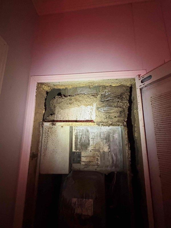 Responded to no cooling complaint on residential AC system approximately 4 years old. Upon inspection, found evaporator coil completely frozen with extensive ice buildup throughout air handler cabinet. System history indicates refrigerant additions in 2021 and 2023, plus capacitor replacement in 2023, suggesting chronic refrigerant leak losing charge approximately every two years. Verified low refrigerant pressures using manifold gauges, with suction pressure reading 31°F and abnormal system temperatures confirming undercharge condition. Documented frozen coil condition with photographic evidence showing severe frost accumulation on evaporator and surrounding surfaces. Recommended system leak detection and repair to address underlying issue causing repeated refrigerant loss rather than continued recharging.