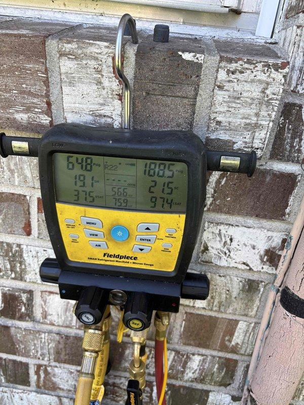 Installed primary float switch to evaporator coil on upflow HVAC system as preventative measure against future flooding incidents. System operates without drain pan and had previously experienced water overflow resulting in floor damage. Float switch installation provides automatic system shutdown protection in the event of drain line blockage or excessive condensate accumulation.