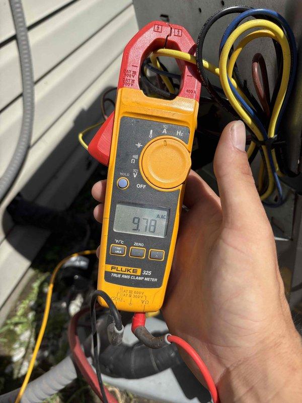 Replaced defective thermal expansion valve (TXV) and liquid line filter drier under warranty on HVAC system. Retrieved replacement parts from Carrier supply house and performed complete component installation. Verified proper system operation using Fluke 325 clamp meter to confirm electrical readings of 9.70 amps and Fieldpiece SMAN manifold gauge set to monitor refrigerant pressures and temperatures throughout the process. System tested and operating within manufacturer specifications upon completion.