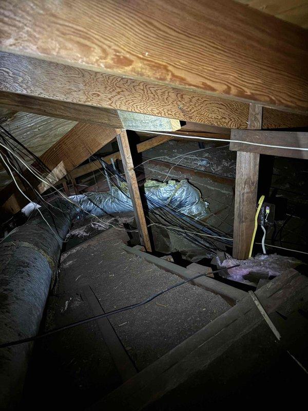 Completed AC summer membership maintenance inspection in attic space. Inspected HVAC ductwork system, including flexible metallic ducting and insulation wrapping for proper condition and secure connections. Verified air handler components accessible through attic space were operating within normal parameters and confirmed electrical wiring routing was properly secured to structural members.