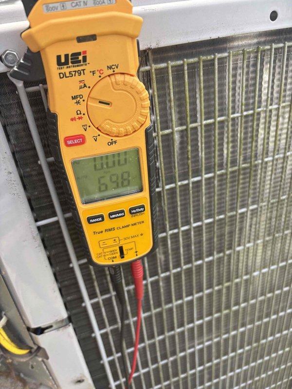 Completed comprehensive AC maintenance inspection and cleaning for single-system residential unit. Performed electrical diagnostics using clamp meter to verify proper amperage draw and system performance at condenser unit. Inspected evaporator coil assembly and heat exchanger components, confirming adequate airflow through fins and proper refrigerant line connections.