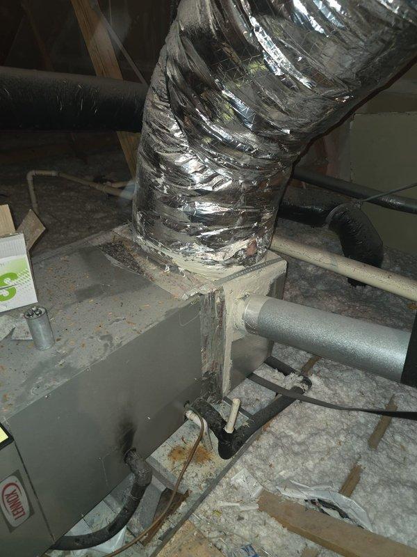 Diagnosed 2007 Lennox electric air conditioning system and identified leak in evaporator coil located in attic space. Inspected outdoor condenser unit and indoor air handler components, documented equipment condition with photos showing flex ductwork, refrigerant line sets, and plenum connections. Presented customer with repair and replacement options for failed evaporator coil.