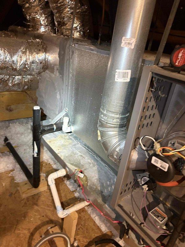 Completed routine maintenance and inspection on residential HVAC system for new homeowner unfamiliar with equipment. Documented system information and captured photographs of attic-mounted furnace installation and outdoor condensing unit. Observed heavy accumulation of dirt and debris on condenser coil fins requiring attention. Corrected air filter placement issue and provided guidance on proper filter location. Discussed preventative maintenance program benefits with homeowner for future consideration.