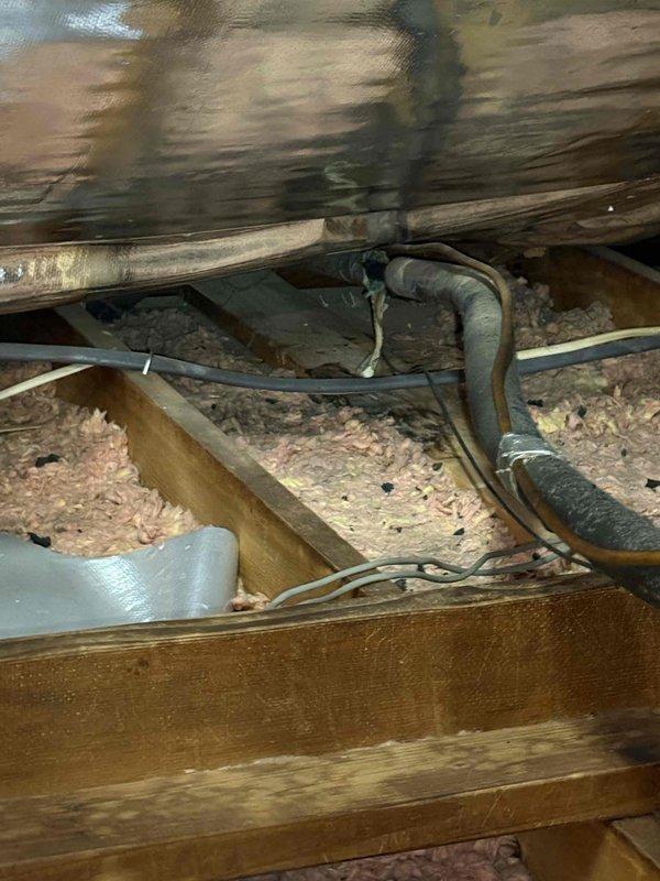 Completed comprehensive AC system cleaning and inspection on unit installed in 2021. Investigated customer-reported ceiling leak in bedroom suspected to be caused by condensation on attic refrigerant lines. Inspected attic HVAC infrastructure including ductwork and insulation, documented existing duct damage with worn outer layer and verified system operation. Provided membership program information via email per customer request.