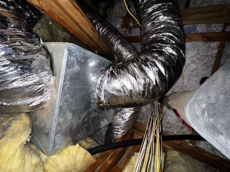 Reattached flexible aluminum supply duct that had become disconnected in the attic space. The duct was properly secured back to the HVAC plenum junction point and fastened with appropriate strapping to ensure proper airflow to the designated zone. Verified all connections were tight and ductwork was properly supported to prevent future disconnection.
